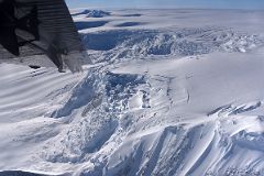 08A Airplane Turning With Broken Up Glacier Below Preparing To Land At Mount Vinson Base Camp.jpg